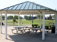 Rest area with picnic tables.  Bike trail in the background